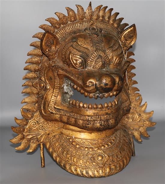 A South East Asian gilt bronze lion mask